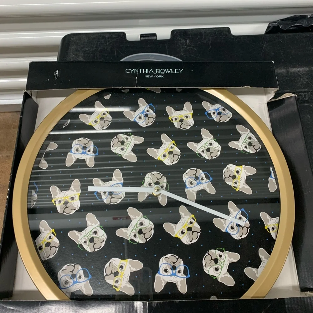 New in box wall clock with cute dog design. Approx 14”